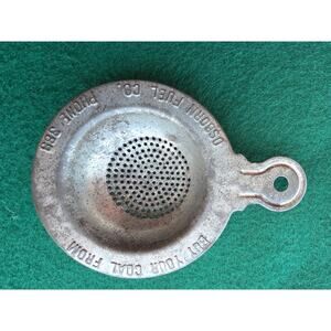 Vintage tin advertising tea strainer